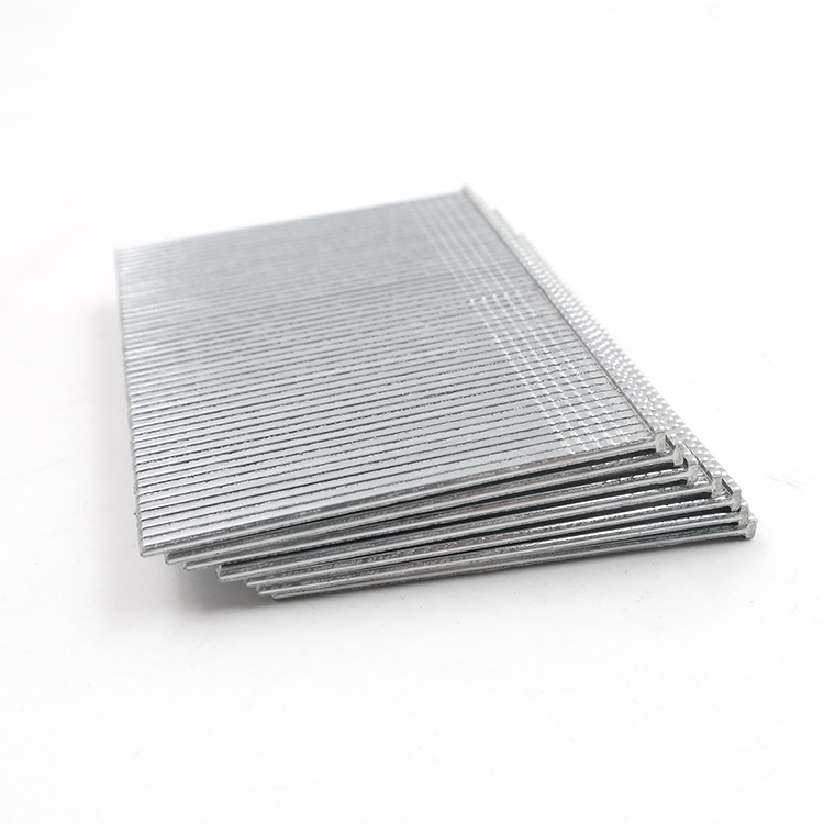 Stacked galvanized brad nail strips close-up